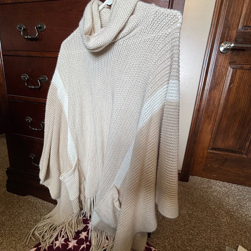 Charlie Paige Cream Turtleneck Fringe Knit Poncho with White Accents